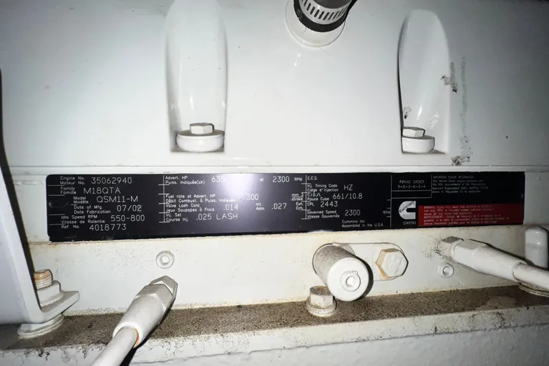 Slide: The Image of Engine specifications label on a 2003 Sea Ray 480 Motor Yacht. - 35