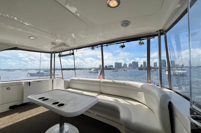 Slide: The Image of Luxurious 2003 Sea Ray 480 Motor Yacht interior with waterfront cityscape view. - 181