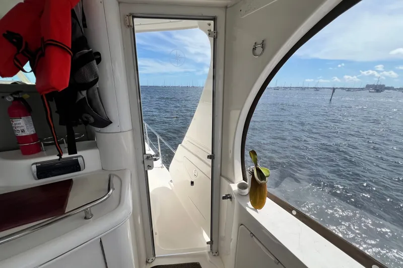 Slide: The Image of Interior view of 2003 Sea Ray 480 Motor Yacht overlooking ocean through door. - 186