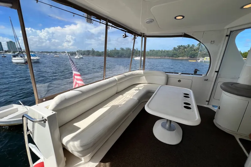 Slide: The Image of Luxurious 2003 Sea Ray 480 Motor Yacht interior with waterfront view and comfortable seating. - 183