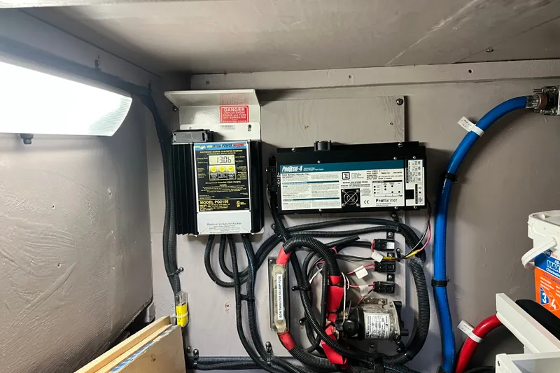 Slide: The Image of Electrical system components in a 2003 Sea Ray 480 Motor Yacht engine room. - 55