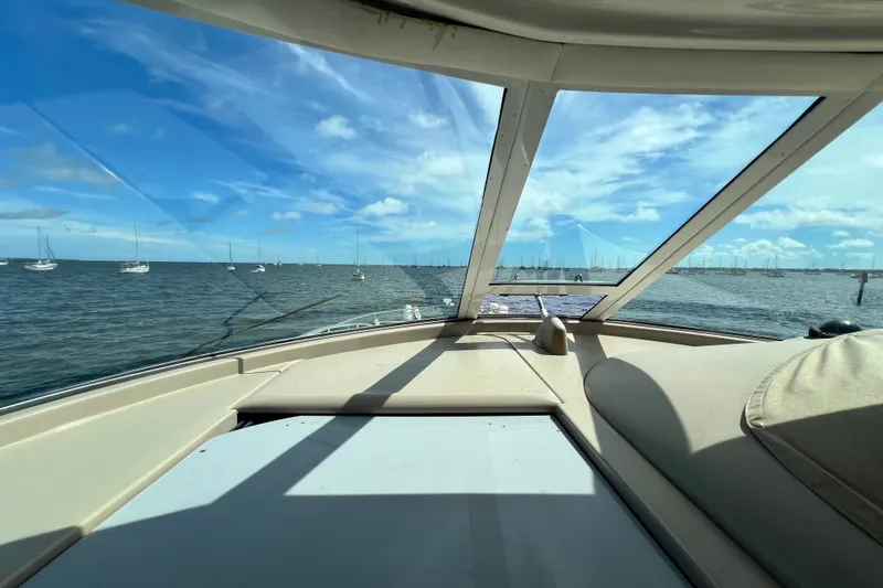 Slide: The Image of View from 2003 Sea Ray 480 Motor Yacht cockpit, overlooking serene ocean and sailboats. - 168
