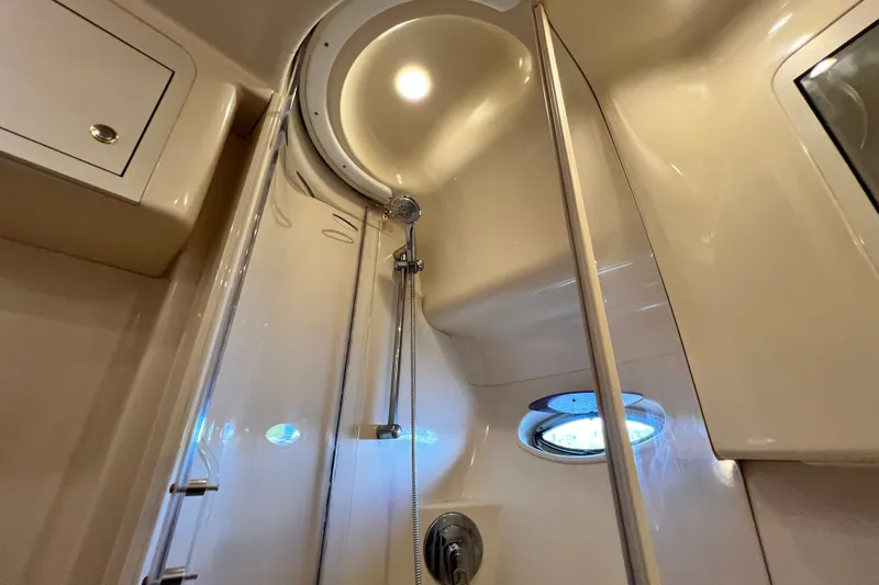 Slide: The Image of Shower area inside 2003 Sea Ray 480 Motor Yacht with modern fixtures and porthole window. - 117