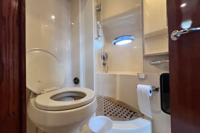 Slide: The Image of Bathroom interior of 2003 Sea Ray 480 Motor Yacht with shower and toilet. - 112