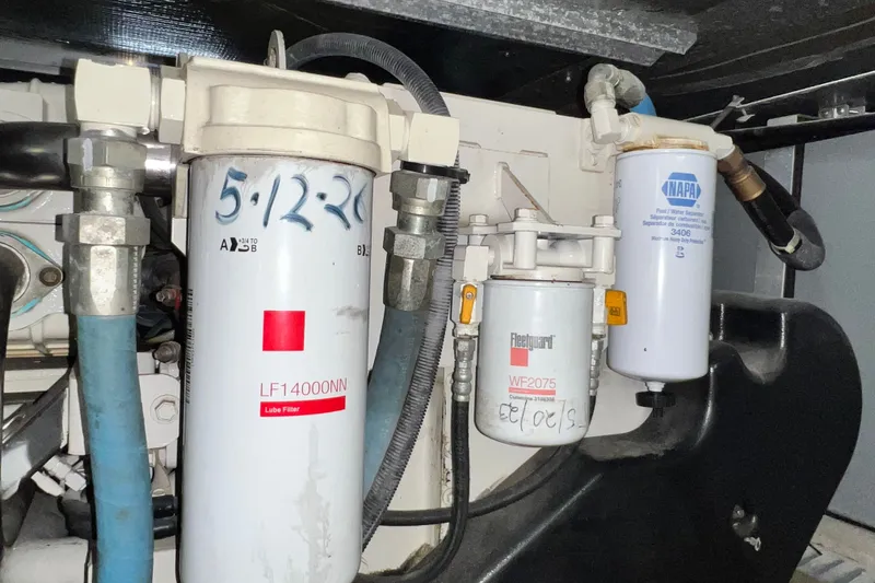 Slide: The Image of Engine filters in a 2003 Sea Ray 480 Motor Yacht, featuring Fleetguard and NAPA components. - 43