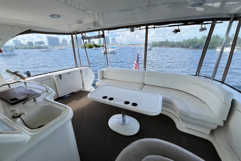 Slide: The Image of Luxurious 2003 Sea Ray 480 Motor Yacht interior with scenic waterfront view. - 170