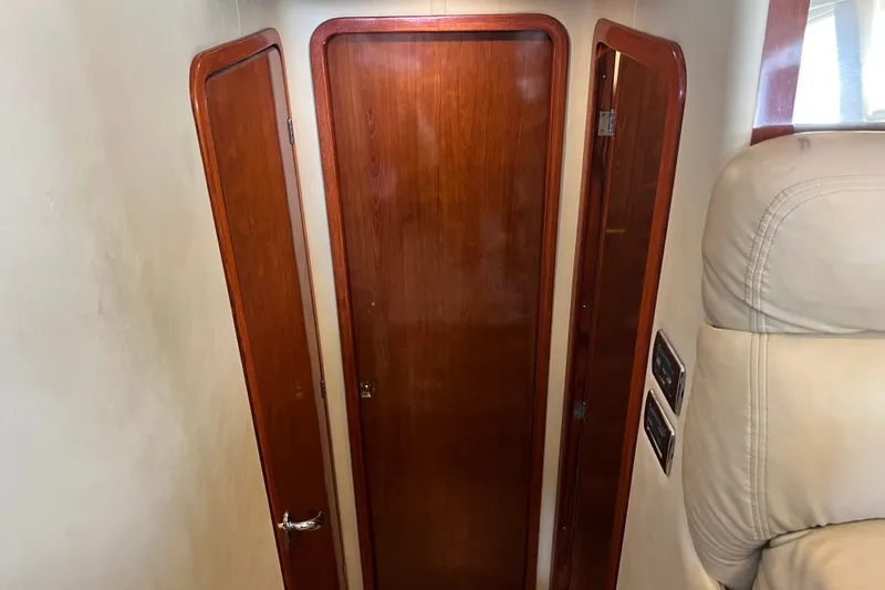 Slide: The Image of Wooden door and paneling inside a 2003 Sea Ray 480 Motor Yacht cabin. - 118