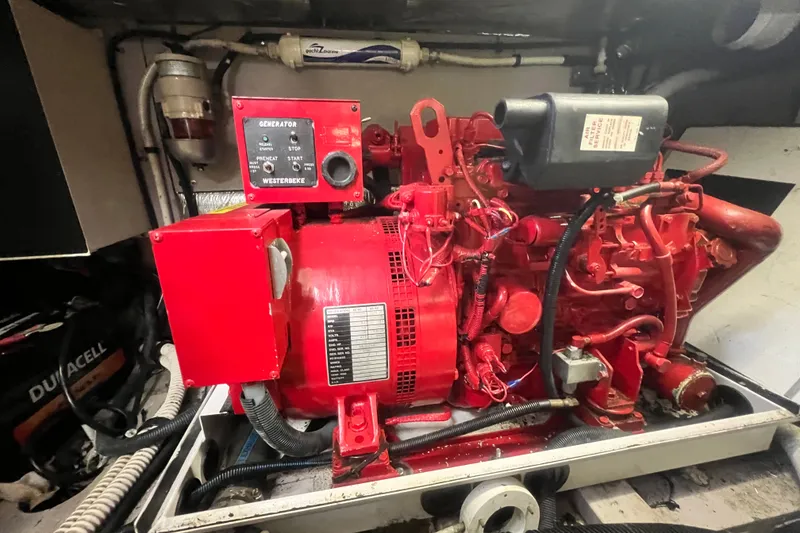 Slide: The Image of Red Westerbeke generator in a 2003 Sea Ray 480 Motor Yacht engine room. - 28