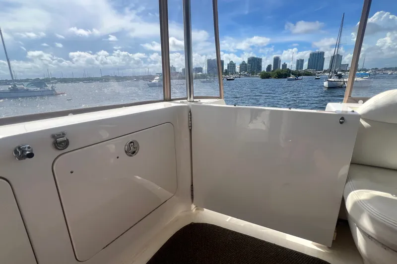 Slide: The Image of 2003 Sea Ray 480 Motor Yacht interior with marina view and city skyline. - 192