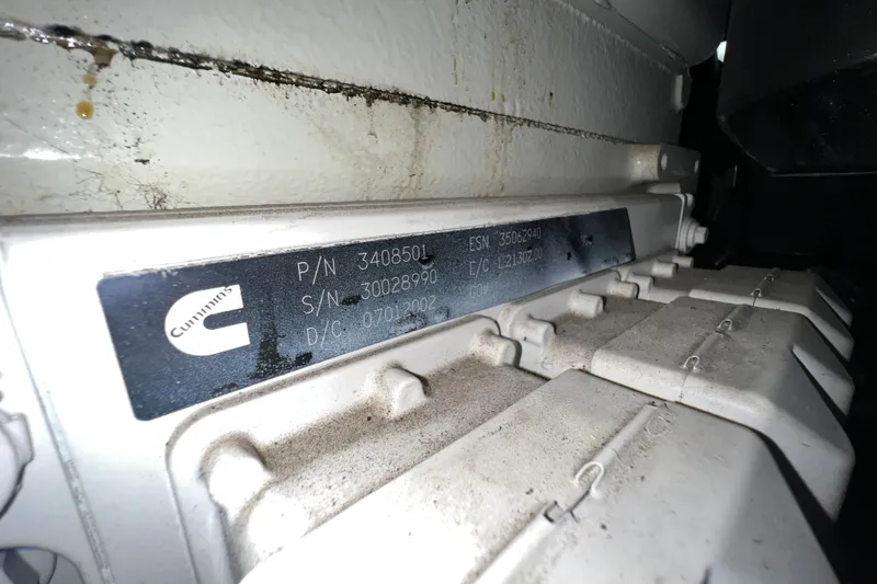 Slide: The Image of Cummins engine label on a 2003 Sea Ray 480 Motor Yacht, showing part and serial numbers. - 34