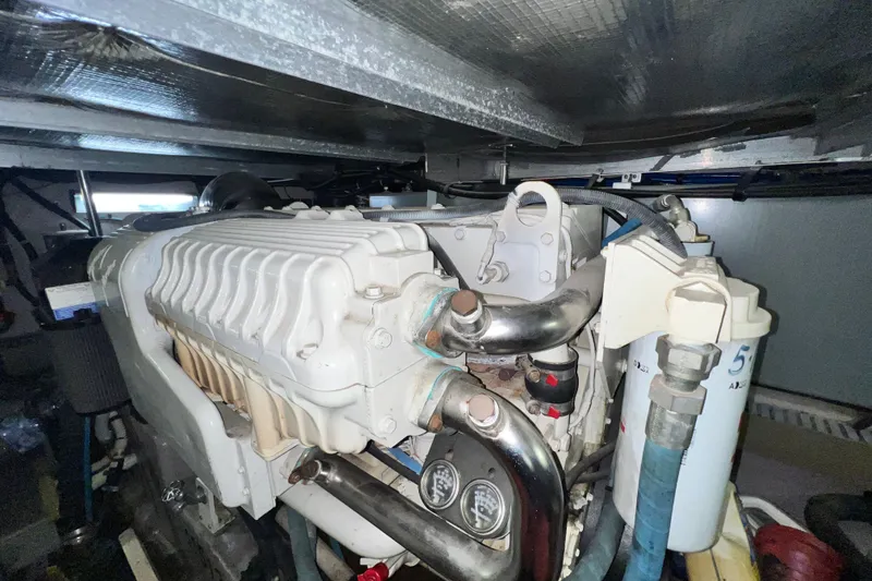 Slide: The Image of Engine compartment of a 2003 Sea Ray 480 Motor Yacht, showcasing mechanical components. - 37