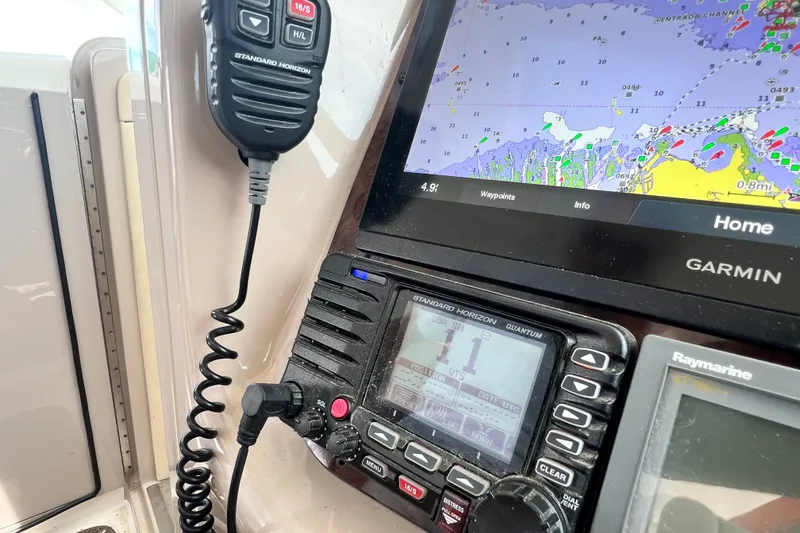 Slide: The Image of Control panel of a 2003 Sea Ray 480 Motor Yacht with Garmin navigation system. - 92