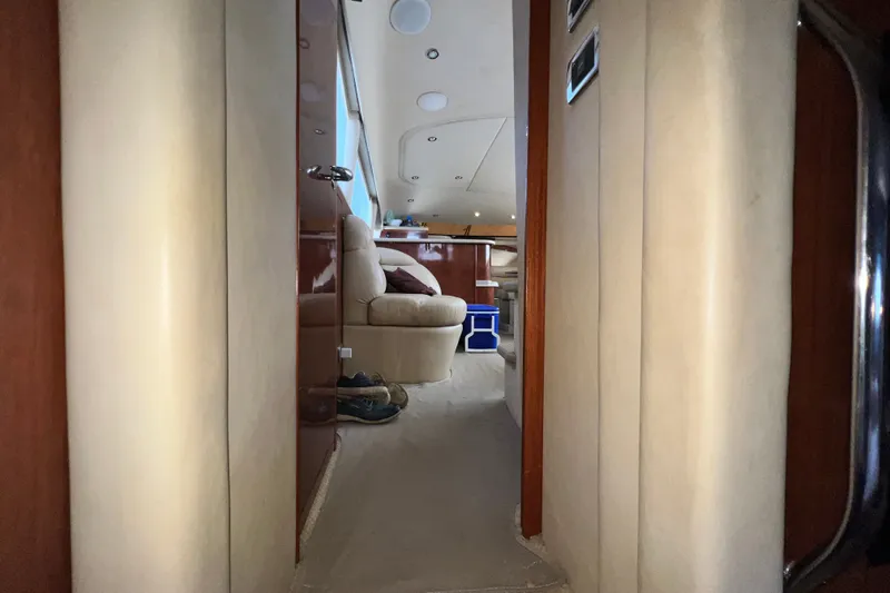 Slide: The Image of Interior hallway of 2003 Sea Ray 480 Motor Yacht, featuring plush seating and elegant design. - 145