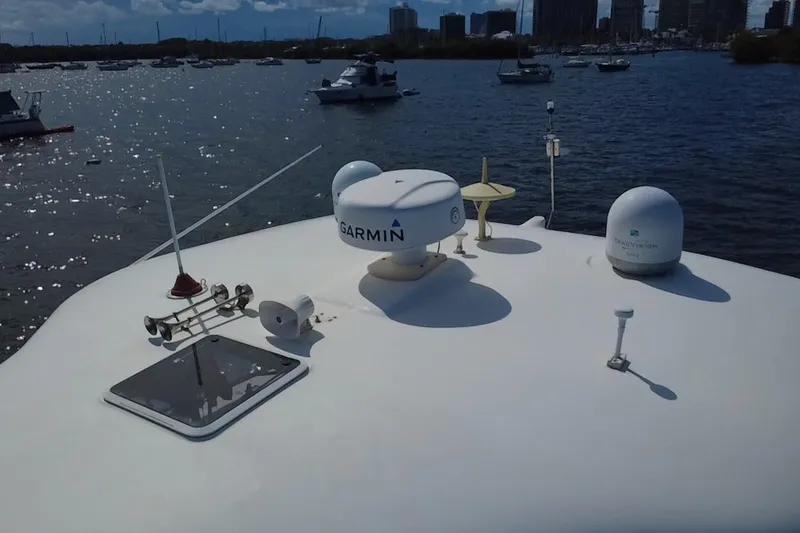 Slide: The Image of Rooftop view of 2003 Sea Ray 480 Motor Yacht with Garmin equipment, docked in a marina. - 207