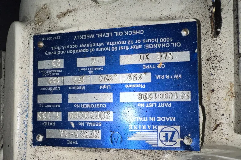 Slide: The Image of Close-up of a blue engine specification plate on a 2003 Sea Ray 480 Motor Yacht. - 41