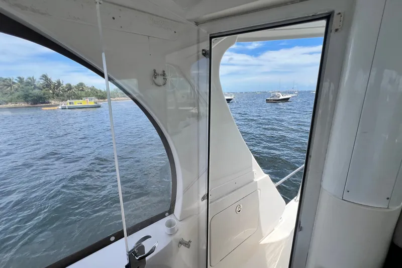 Slide: The Image of View from 2003 Sea Ray 480 Motor Yacht, overlooking serene waters and anchored boats. - 80