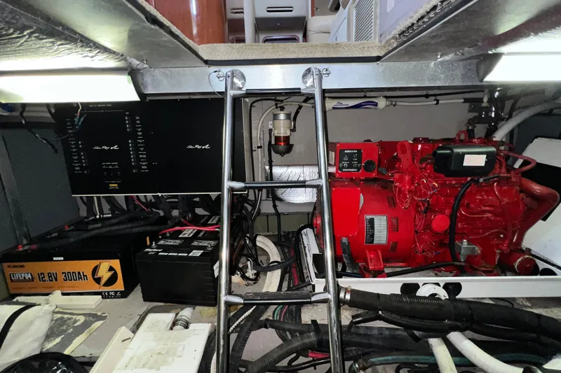 Slide: The Image of Engine room of a 2003 Sea Ray 480 Motor Yacht with visible machinery and equipment. - 44