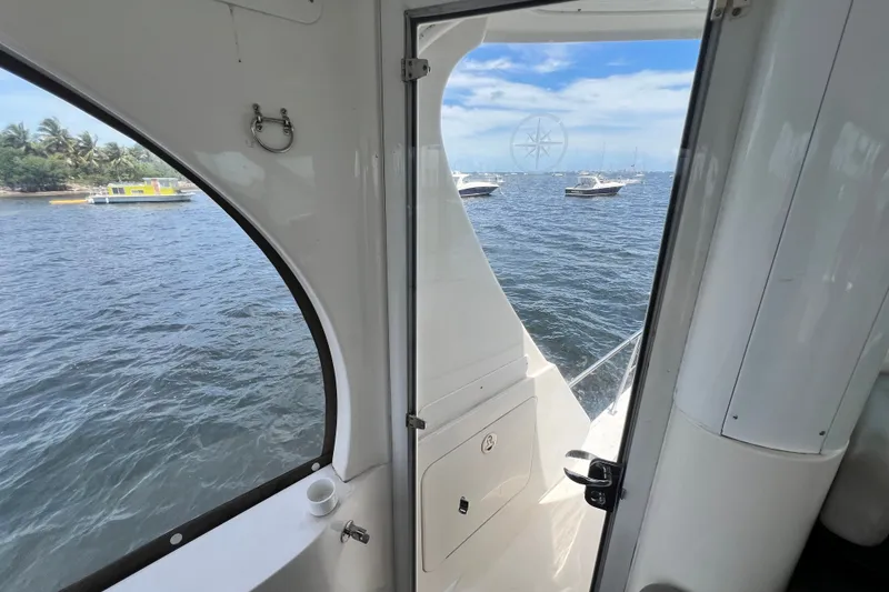 Slide: The Image of View from 2003 Sea Ray 480 Motor Yacht, overlooking calm waters and anchored boats. - 81