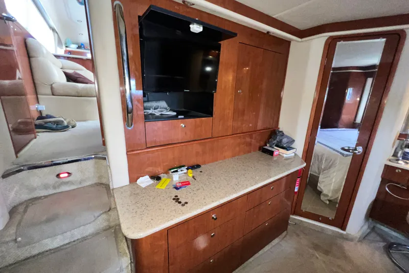 Slide: The Image of Interior of 2003 Sea Ray 480 Motor Yacht with wooden cabinetry and modern amenities. - 142