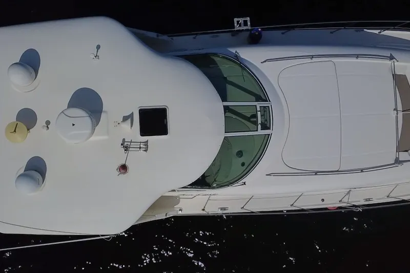 Slide: The Image of Aerial view of 2003 Sea Ray 480 Motor Yacht, showcasing sleek design and spacious deck. - 199