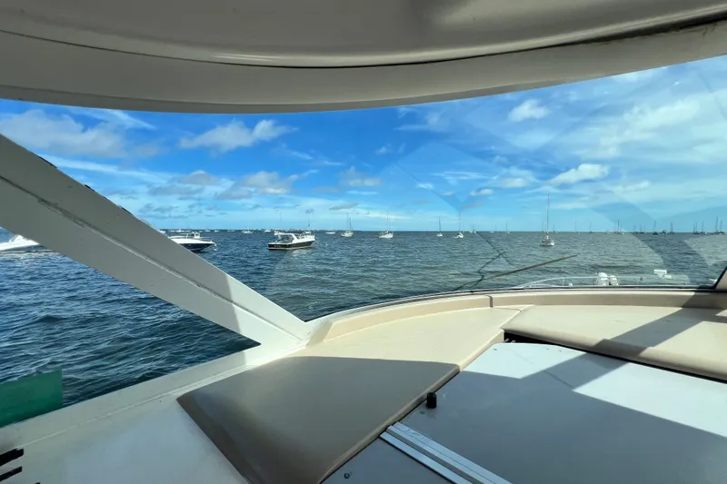 Slide: The Image of View from 2003 Sea Ray 480 Motor Yacht, overlooking a serene ocean with boats. - 167