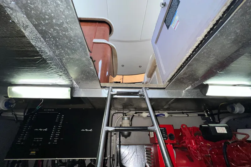 Slide: The Image of Engine room of 2003 Sea Ray 480 Motor Yacht with ladder and equipment. - 49
