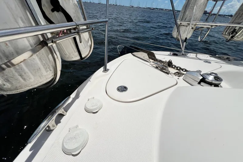 Slide: The Image of 2003 Sea Ray 480 Motor Yacht deck with anchor chain and ocean view. - 62