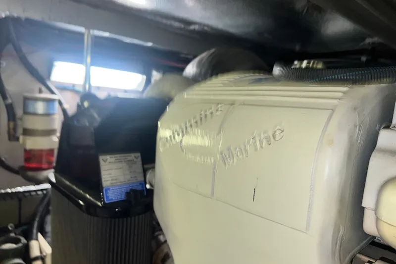 Slide: The Image of Engine room of a 2003 Sea Ray 480 Motor Yacht, showcasing marine equipment. - 31