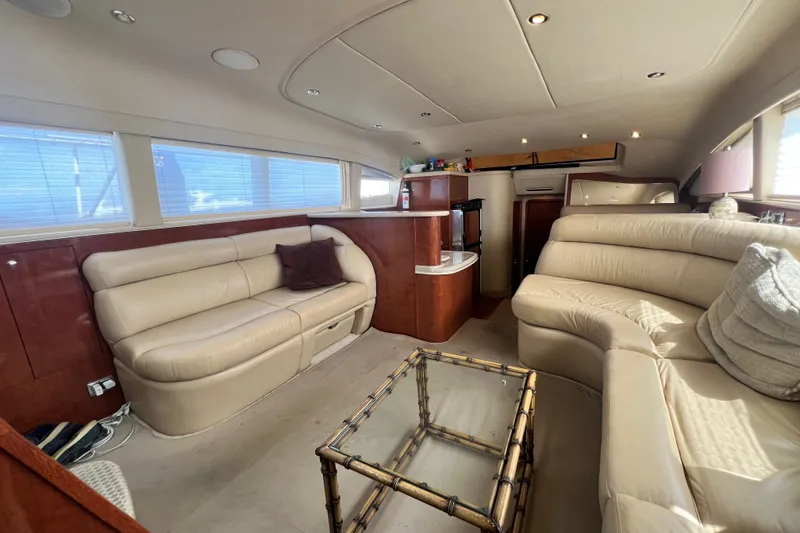 Slide: The Image of Luxurious interior of 2003 Sea Ray 480 Motor Yacht with plush seating and elegant decor. - 154