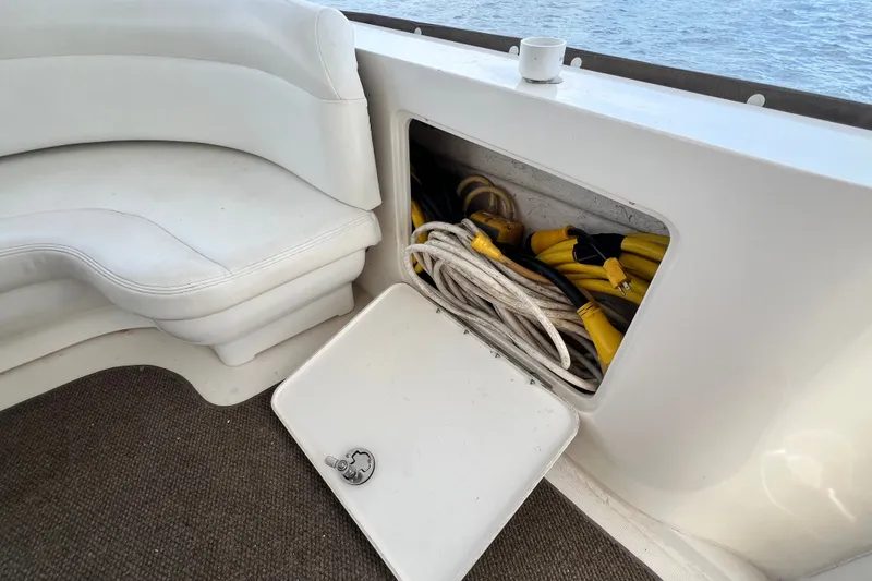 Slide: The Image of Storage compartment on 2003 Sea Ray 480 Motor Yacht with cables and seating. - 85