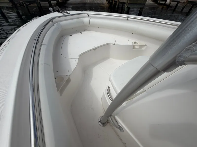 Slide: The Image of The image shows the bow area of a 2006 Boston Whaler 240 Outrage with seating. - 11