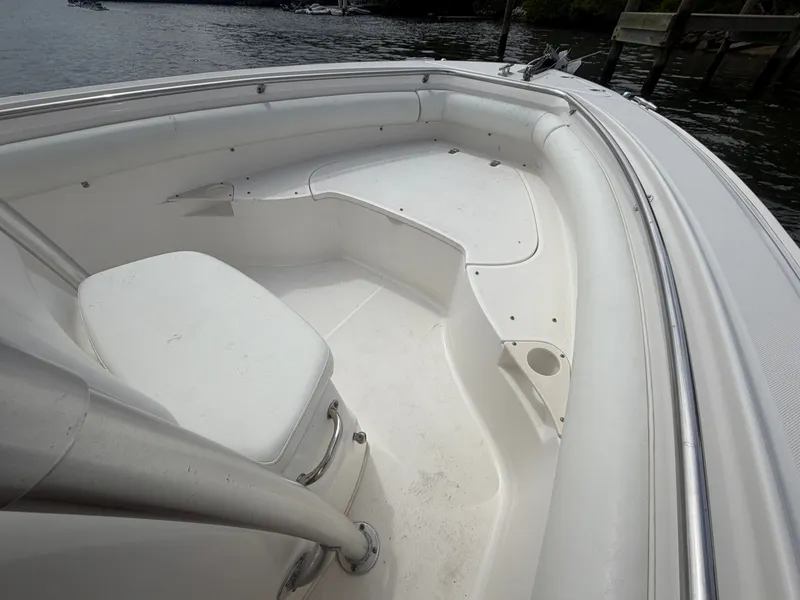 Slide: The Image of The image shows the bow area of a 2006 Boston Whaler 240 Outrage. - 12