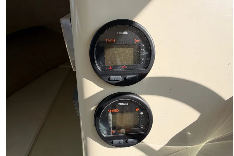 Slide: The Image of Two Yamaha gauges for tachometer and speed are mounted on the cabin wall of a Parker 2120 Sport Cabin boat. - 9
