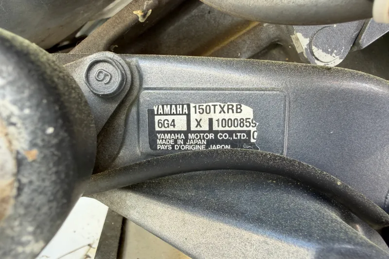 Slide: The Image of Yamaha 150TXRB engine label on a 2003 Parker 2120 Sport Cabin boat. - 23