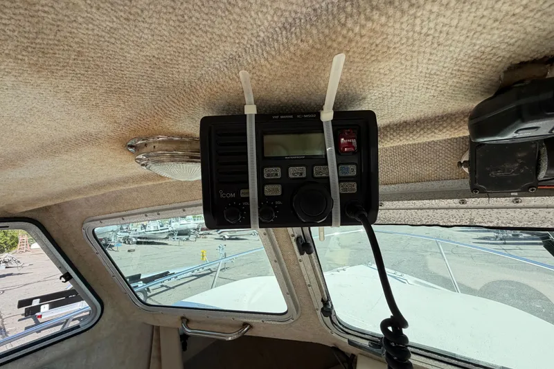 Slide: The Image of Interior of a 2003 Parker 2120 Sport Cabin with marine radio equipment. - 18