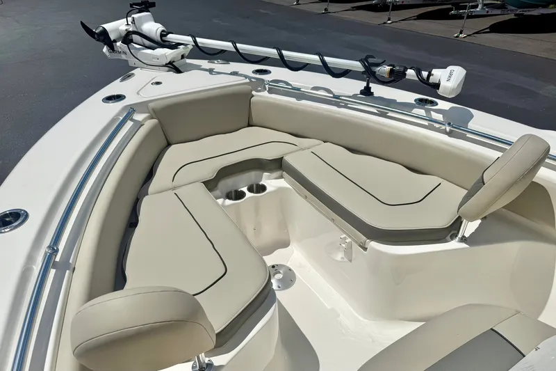 Slide: The Image of 2025 Key West 219 FS boat interior with cushioned seating and mounted equipment. - 13