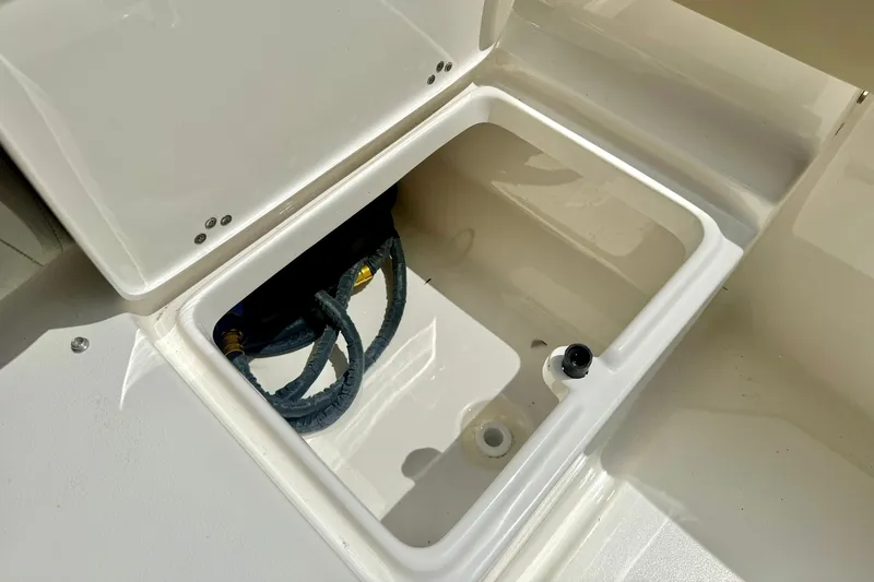 Slide: The Image of Open storage compartment on 2025 Key West 219 FS boat, showcasing interior details. - 32