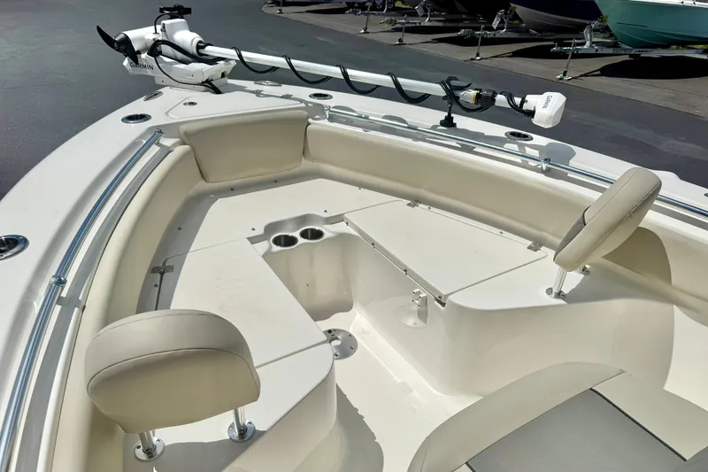 Slide: The Image of 2025 Key West 219 FS boat interior with seating and trolling motor. - 15