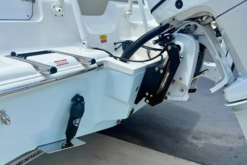 Slide: The Image of 2025 Key West 219 FS boat stern with motor and hydraulic system. - 36