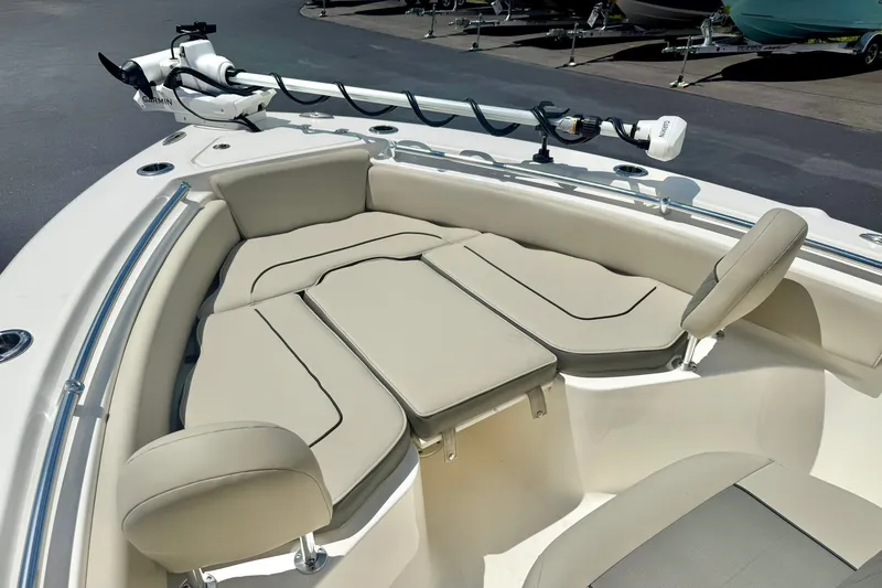 Slide: The Image of 2025 Key West 219 FS boat with cushioned seating and Garmin trolling motor. - 11