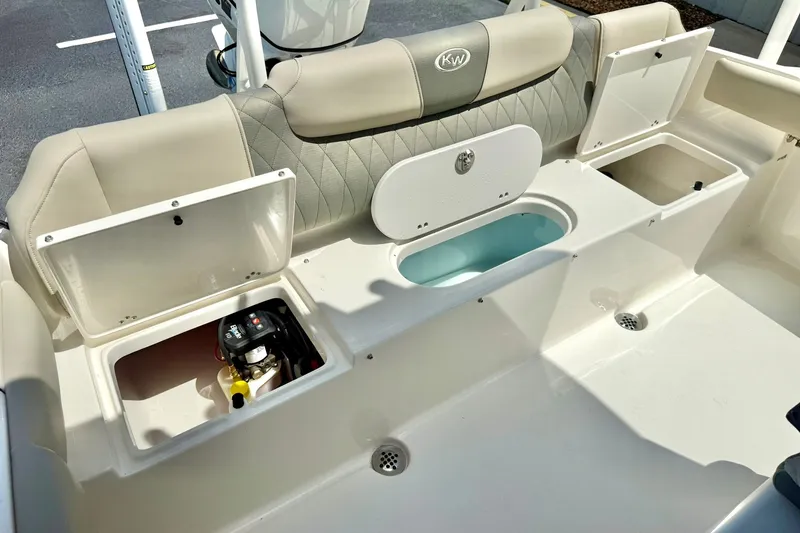 Slide: The Image of 2025 Key West 219 FS boat interior with storage compartments and seating. - 29