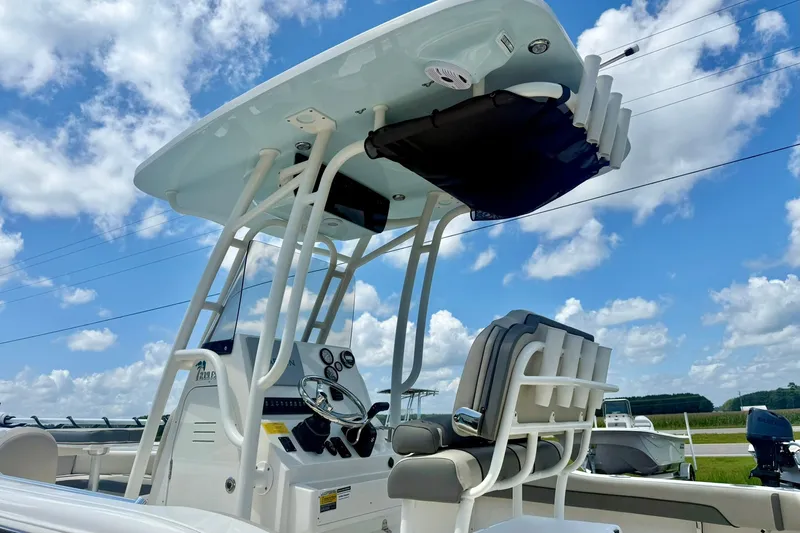 Slide: The Image of 2025 Key West 219 FS boat console under clear blue sky. - 37