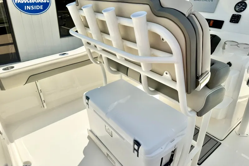 Slide: The Image of 2025 Key West 219 FS boat interior with rod holders and cooler. - 23