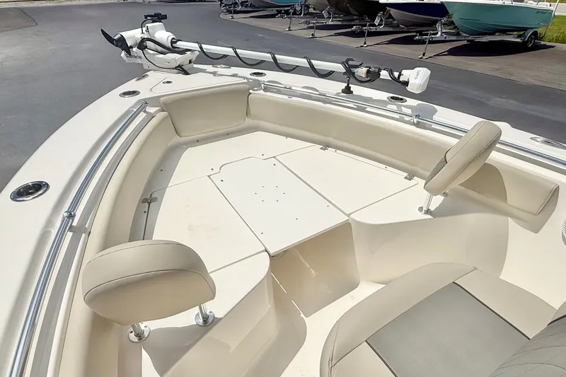 Slide: The Image of 2025 Key West 219 FS boat interior with seating and trolling motor. - 14