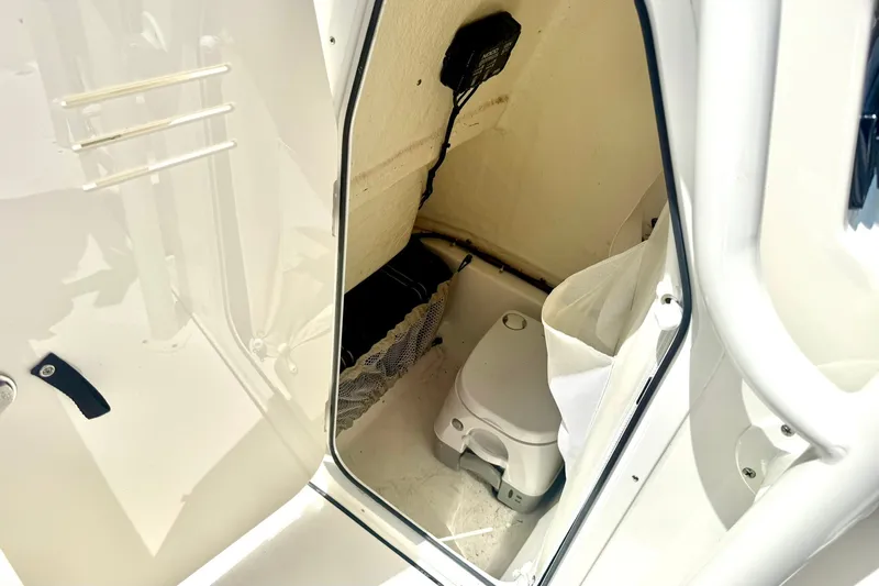 Slide: The Image of Interior view of 2025 Key West 219 FS boat's compact restroom area. - 20