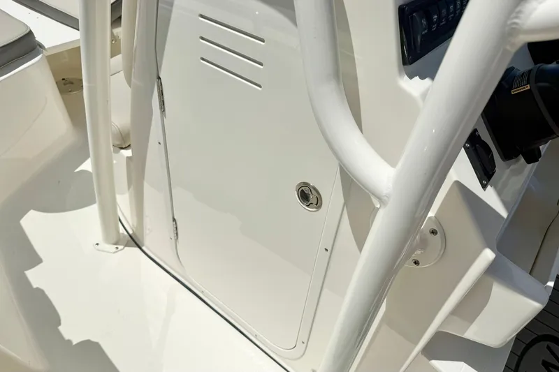 Slide: The Image of 2025 Key West 219 FS boat console detail with white finish and control panel. - 19