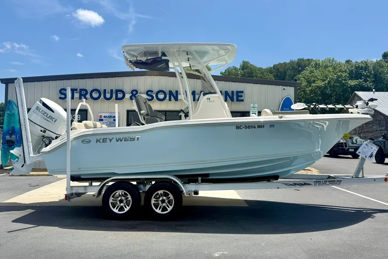 Slide: The Image of 2025 Key West 219 FS boat on trailer at Stroud & Son Marine dealership. - 7