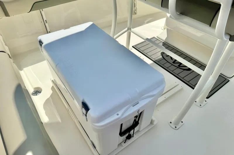 Slide: The Image of 2025 Key West 219 FS boat interior with cooler and seating area. - 24