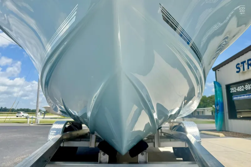 Slide: The Image of 2025 Key West 219 FS boat hull on trailer, showcasing sleek design and craftsmanship. - 10