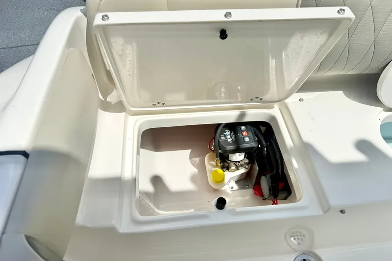 Slide: The Image of Open storage compartment on 2025 Key West 219 FS boat, revealing internal components. - 30